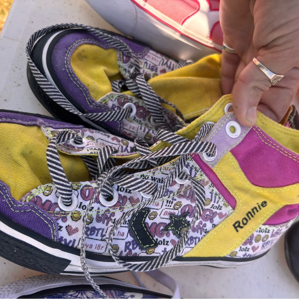 Converse woman’s High-Top Sneakers in Purple, Yellow, and Pink